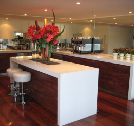 Timber Jarrah kitchen with 80mm benchtops & mirror splashbacks